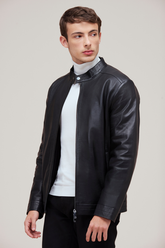 Lamb leather bomber with slim fit, zip features, and quilted lining for versatile style.