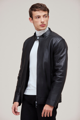 Lamb leather bomber with slim fit, zip features, and quilted lining for versatile style.