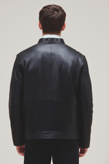 Lamb leather bomber with slim fit, zip features, and quilted lining for versatile style.