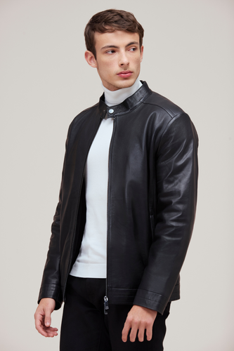 Lamb leather bomber with slim fit, zip features, and quilted lining for versatile style.
