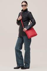 Carolyn Soft lamb leather with funnel neck and tonal zips.