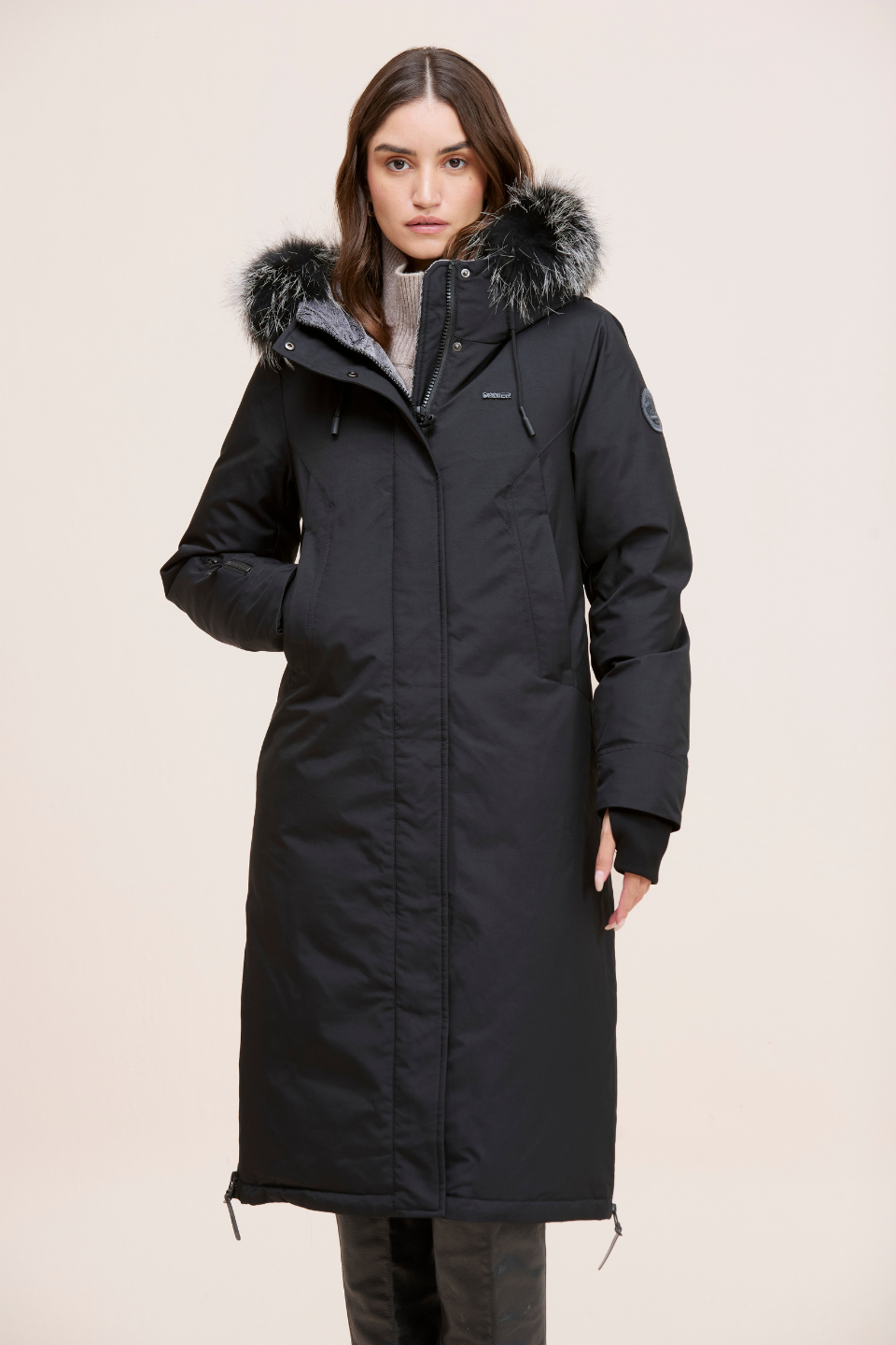 Stacie Ultra-warm down puffer with utility pockets and smart winter features.
