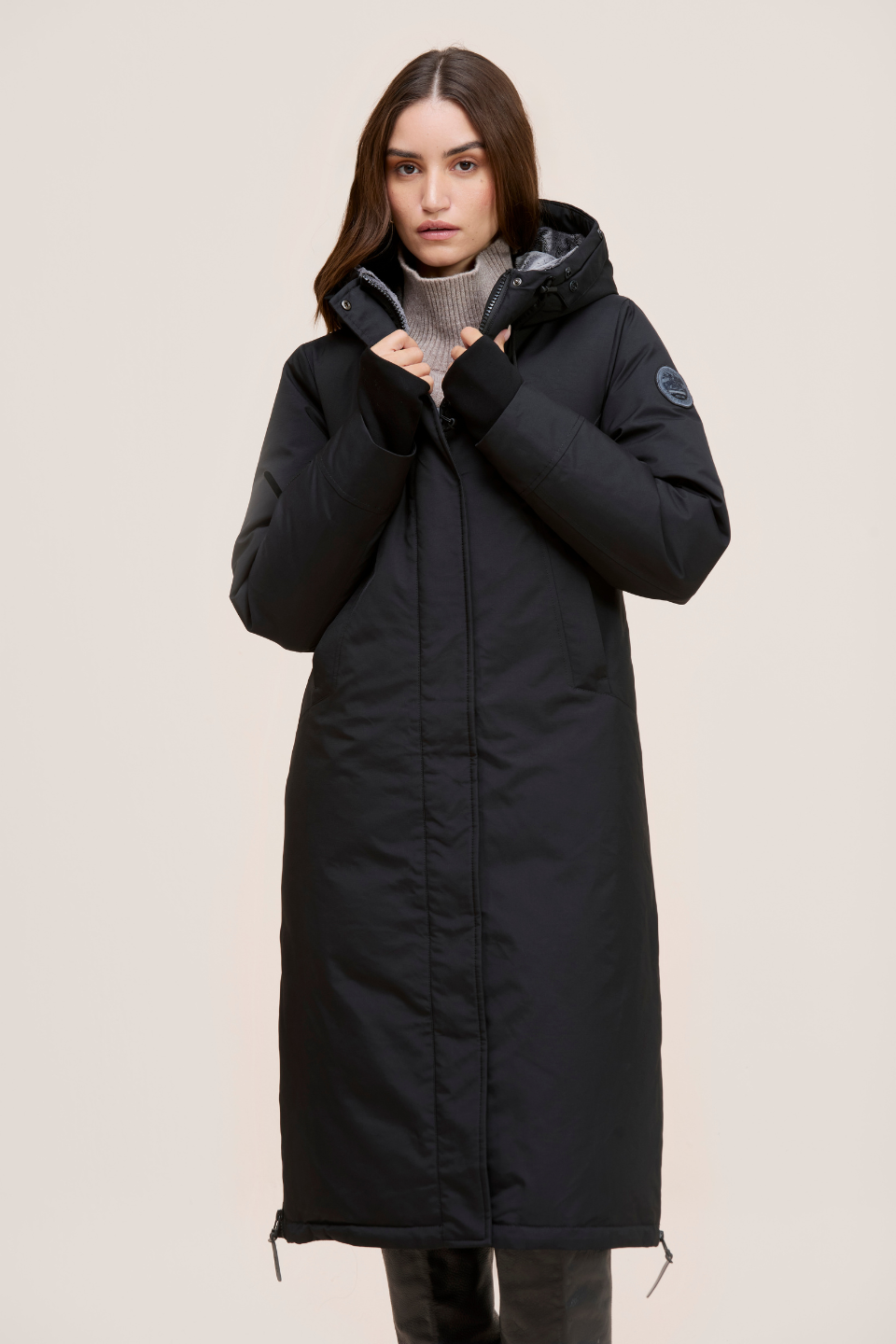 Stacie Ultra-warm down puffer with utility pockets and smart winter features.