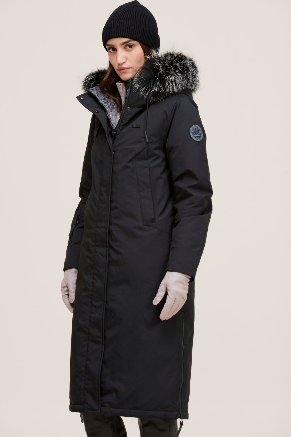 Stacie Ultra-warm down puffer with utility pockets and smart winter features.